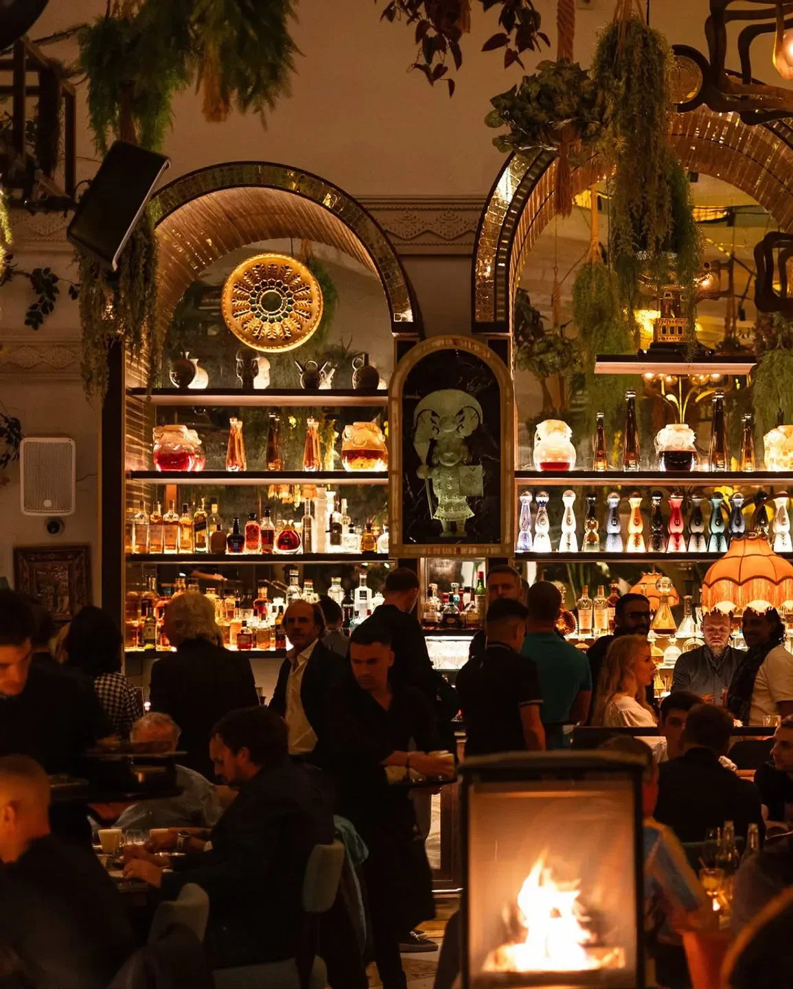 Stylish interior bar scene at COYA Marbella with a warm, inviting atmosphere