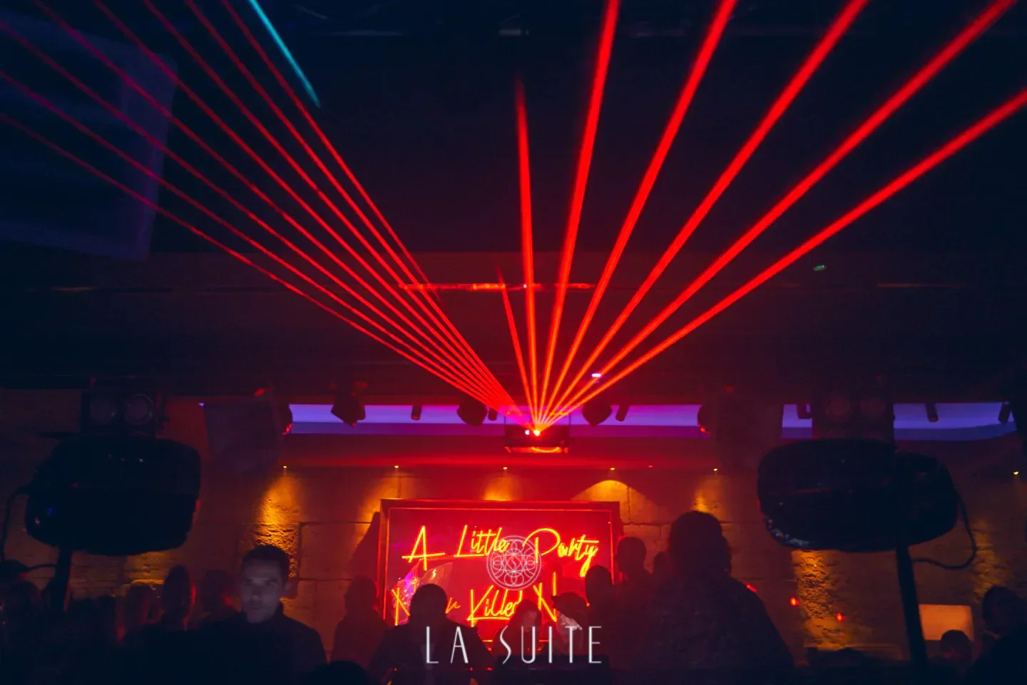 Red laser beams light up the dance floor at La Suite nightclub in Marbella.