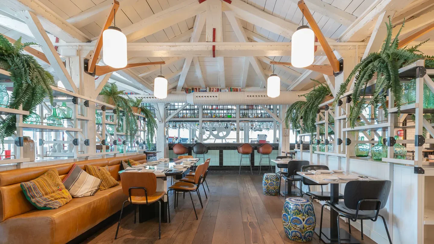 Interior of Lobito de Mar restaurant in Marbella, showcasing stylish decor and seating.