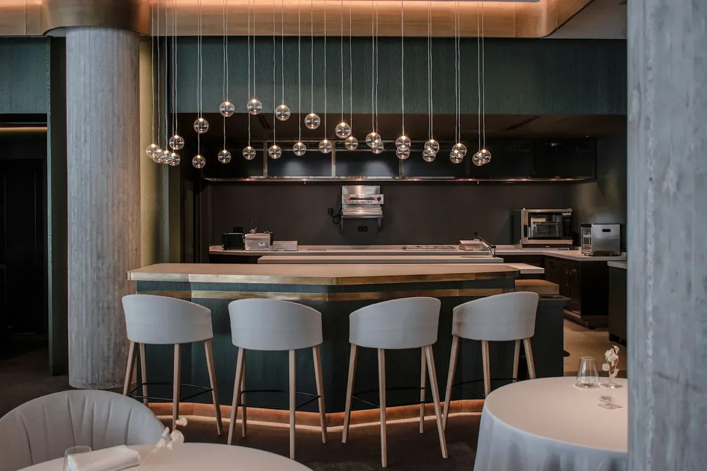 Interior of Messina restaurant in Marbella, featuring stylish bar and modern lighting.