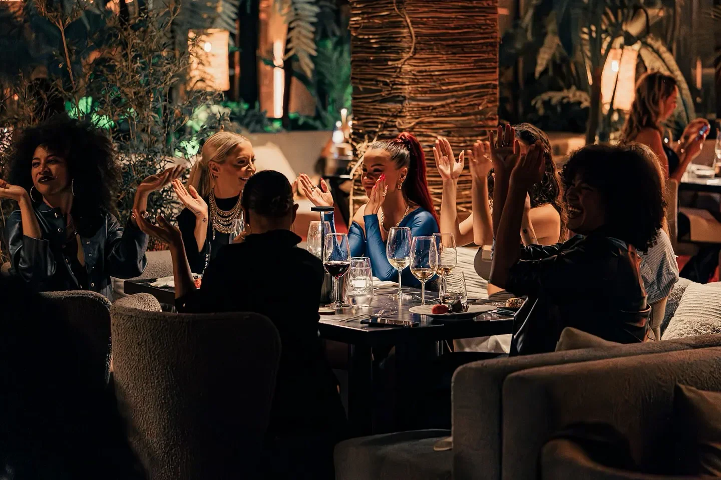 Dining experience at Mogli restaurant in Marbella, with guests enjoying the atmosphere.
