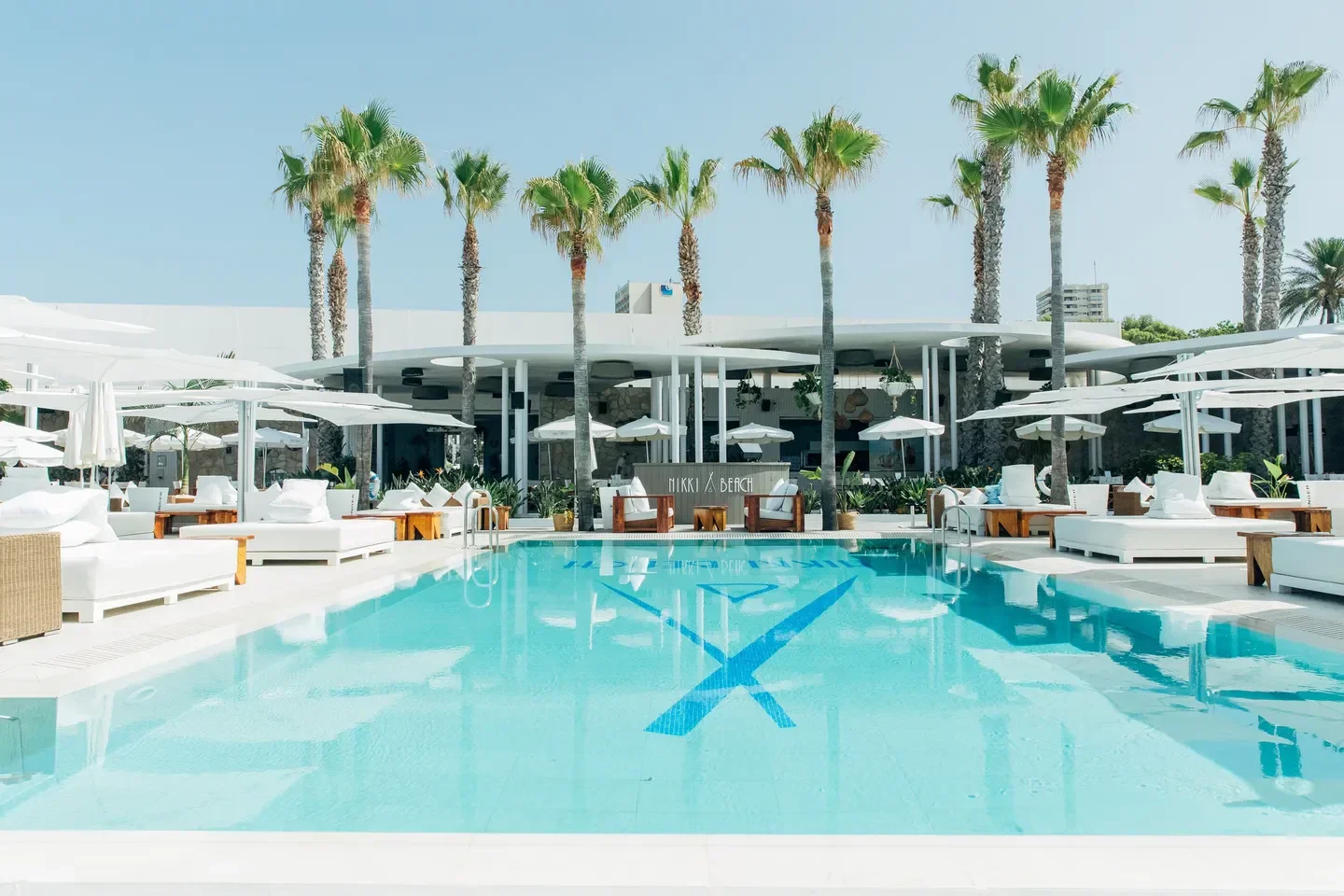 Pool and lounge area at Nikki Beach Marbella, a luxurious beach club.