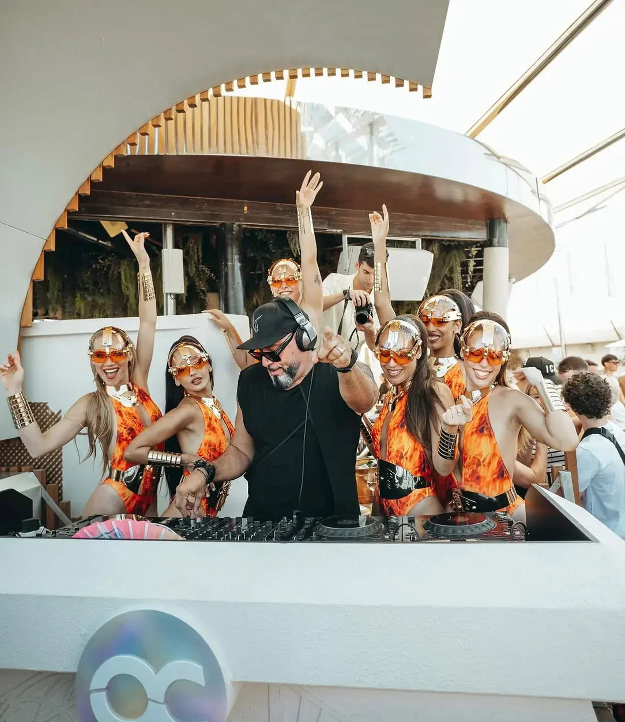 DJ and dancers at Ocean Club Marbella beach club, entertaining the crowd.