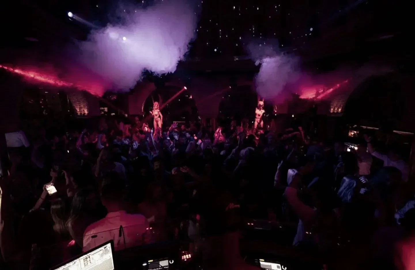 Nightlife at Olivia Valere in Marbella, featuring dancers and a lively crowd.